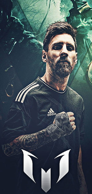 Lionel Messi in dark Adidas jersey with tattooed arm and dramatic green background HD phone wallpaper