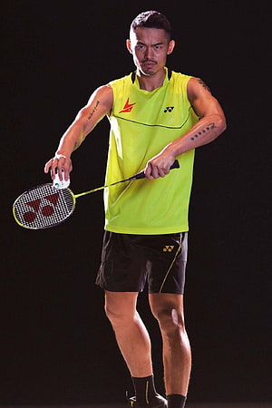 Lin Dan Badminton Player in Yellow Yonex Kit Holding Racket and Shuttlecock HD phone wallpaper