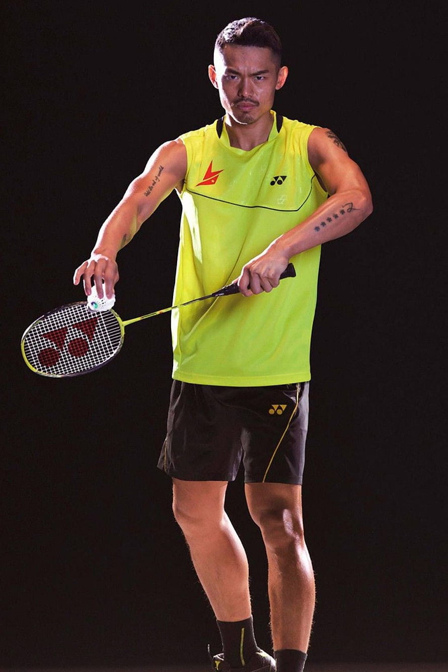 Lin Dan Badminton Player in Yellow Yonex Kit Holding Racket and Shuttlecock HD phone wallpaper