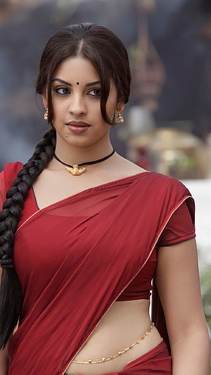 Richa Gangopadhyay in a red sari with gold jewelry and a long braid HD phone wallpaper