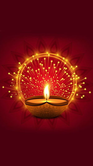 Glowing Diya Oil Lamp with Radiant Fireworks and Mandala Pattern on Deep Red Background HD phone wallpaper