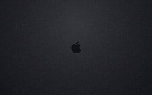 Minimalist Apple Logo on Dark Textured Surface HD wallpaper