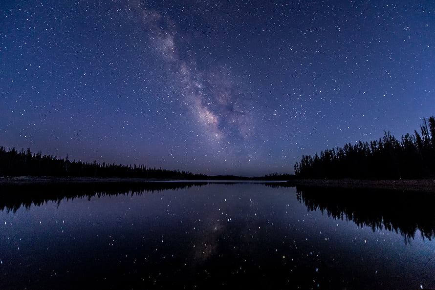 Milky Way Galaxy Reflected in a Calm Lake Under a Starry Night Sky HD wallpaper