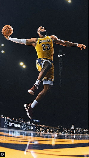 LeBron James in Lakers jersey executing a powerful dunk during an NBA game HD phone wallpaper