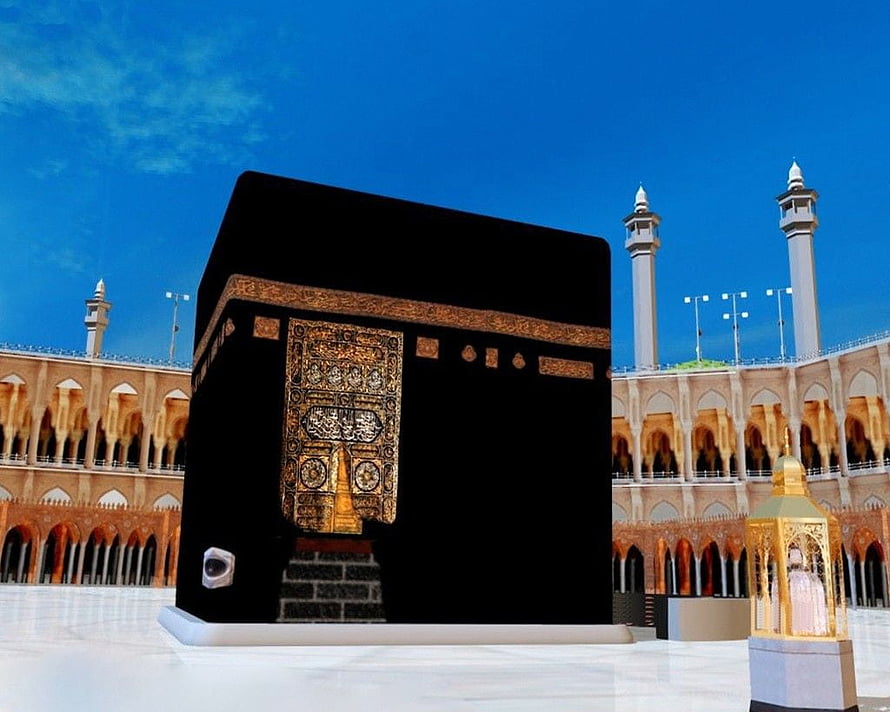 The Holy Kaaba in Mecca with Golden Door and Minarets Under a Clear Blue Sky HD wallpaper