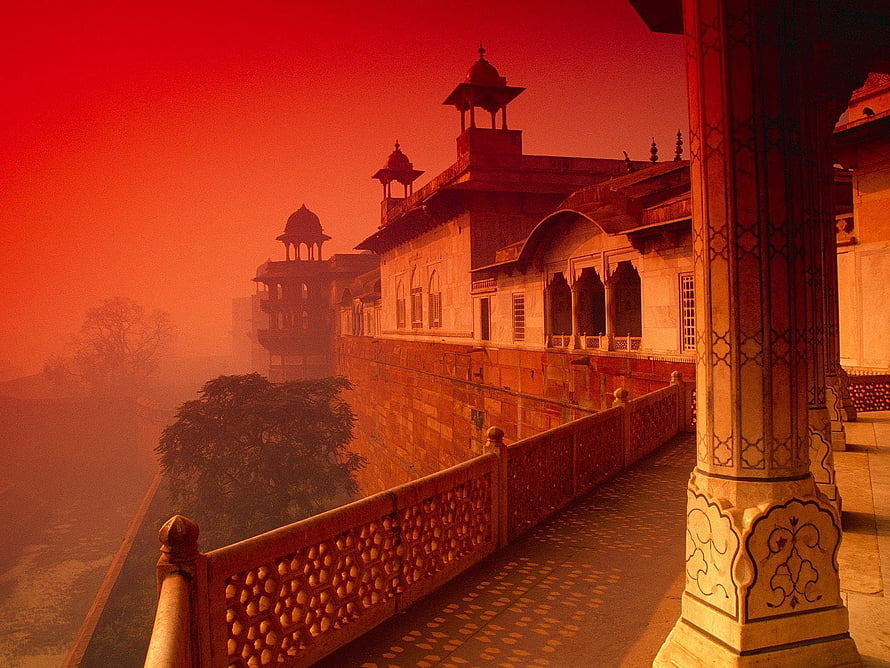 Misty Dawn at an Indian Palace with Ornate Balconies and Red Sky HD wallpaper