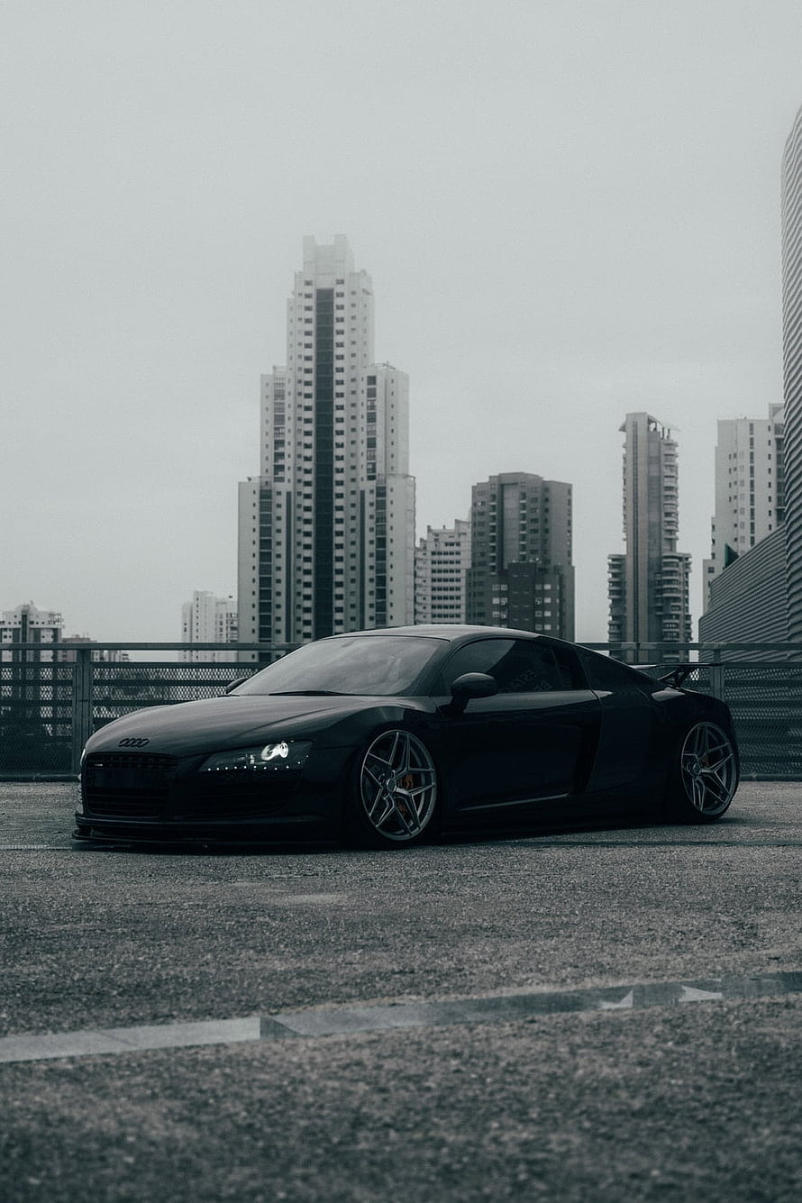 Black Audi R8 Supercar Parked on Urban Rooftop with City Skyline HD phone wallpaper
