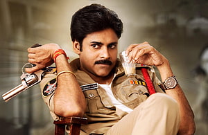 Pavan Kalyan as Gabbar Singh in khaki police uniform holding revolver and glass of chai HD wallpaper