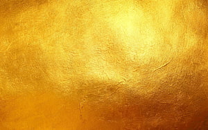 Lustrous Gold Leaf Texture with Warm Amber and Yellow Tones HD wallpaper