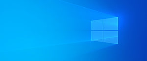 Windows 10 Default Blue Desktop Background with Glowing Window Logo HD wallpaper