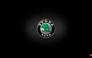 Skoda Auto Emblem on Dark Background with Green Winged Arrow Logo HD wallpaper