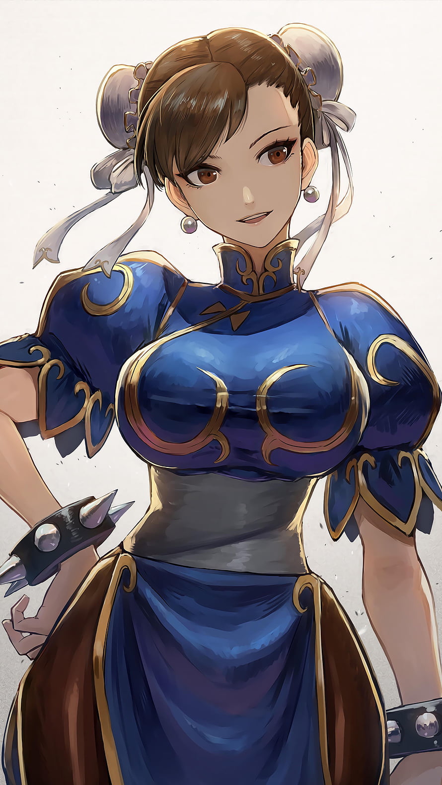 Chun Li from Street Fighter in a blue and gold qipao with ornate armor details and spiked wristbands HD phone wallpaper