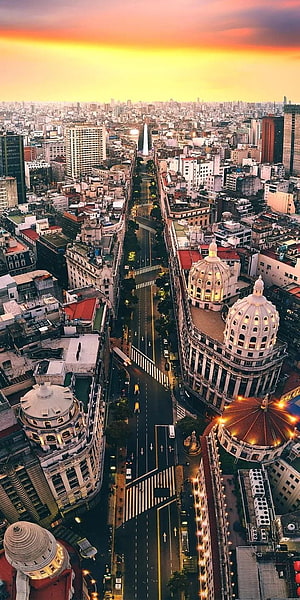 Aerial View of Buenos Aires Cityscape at Sunset with Obelisco de Mayo and Historic Domes HD phone wallpaper