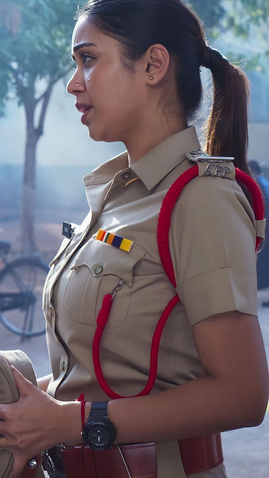 Nivetha Thomas in Indian Police Uniform with Red Samiti Rope and Service Ribbons HD phone wallpaper