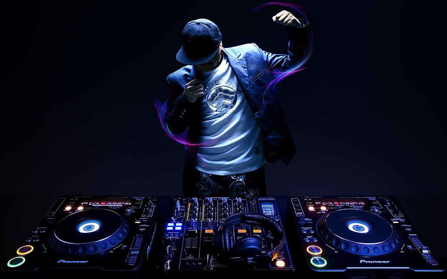 DJ performing at Pioneer turntables with dramatic neon lighting and dark atmosphere HD wallpaper