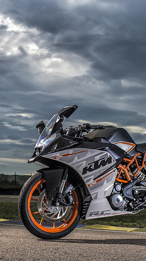 KTM RC 390 Race Competition Motorcycle on Track Under Stormy Sky HD phone wallpaper