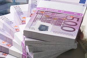 Stacks of 500 Euro Banknotes Bundled with White Paper Bands HD wallpaper