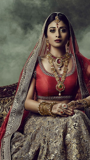 Elegant Indian Bride in Traditional Red Lehenga with Gold Jewelry and Henna HD phone wallpaper