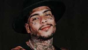 MC Kevin Portrait Wearing Black Hat With Face And Neck Tattoos HD wallpaper