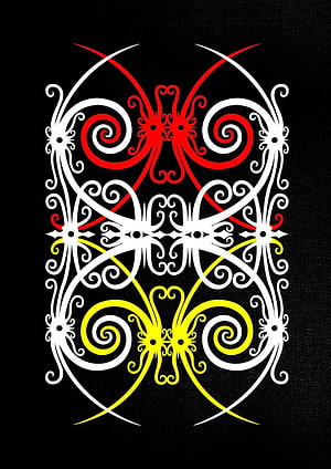 Dayak Tribal Ornamental Pattern with Red and Yellow Spirals on Black Background HD phone wallpaper