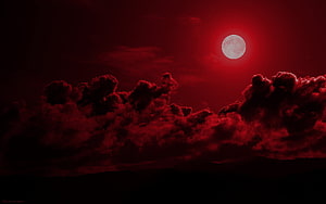Crimson Moon Rising Over Dark Storm Clouds in a Deep Red Night Sky HD wallpaper