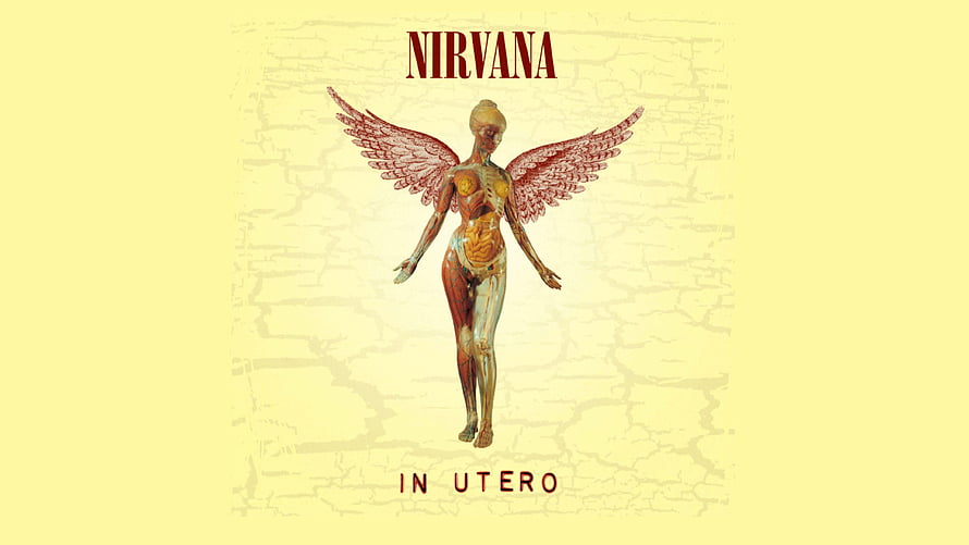Nirvana In Utero Album Artwork Featuring Winged Anatomical Figure on Yellow Background HD wallpaper