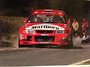 Mitsubishi Lancer Evo 6 Rally Car with Marlboro Livery on Gravel Stage HD wallpaper