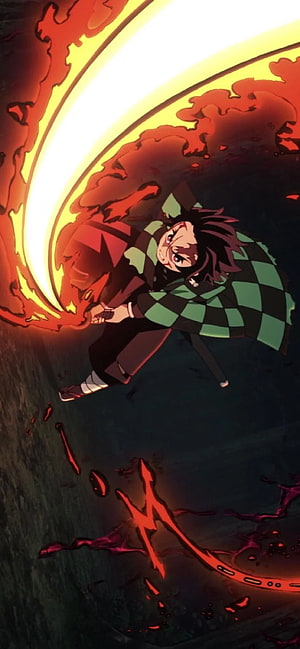 Tanjiro Kamado unleashing a fiery crescent slash in Demon Slayer anime action scene HD phone wallpaper
