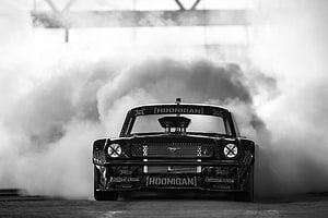 Ken Block Hoonicorn Mustang performing a dramatic burnout in thick smoke HD wallpaper
