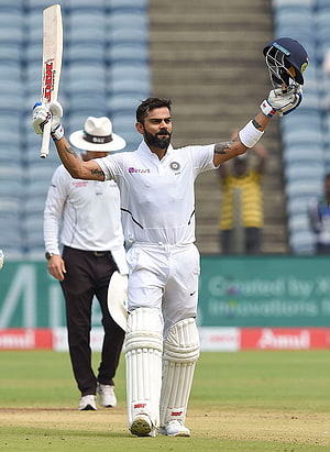 Virat Kohli Acknowledging the Crowd in White Test Cricket Gear HD phone wallpaper