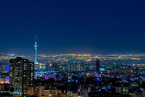 Tehran City Skyline at Night with Milad Tower and Urban Lights HD wallpaper