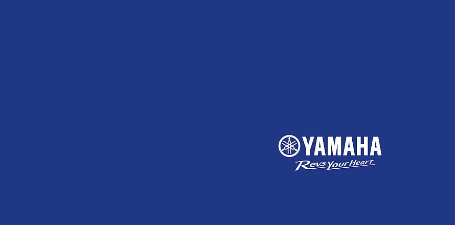 Yamaha Racing Logo on Deep Blue Background with Revs Your Heart Tagline HD wallpaper