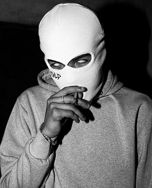 Black and white portrait of a person in a white balaclava smoking a cigarette HD phone wallpaper