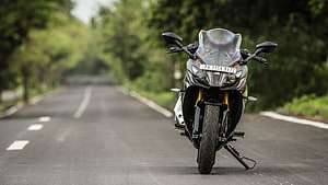 TVS Apache RR310 Sportbike Parked on a Scenic Forest Road HD wallpaper