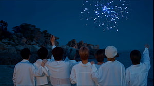 Stray Kids Members Watching Fireworks at Night in White Outfits HD wallpaper