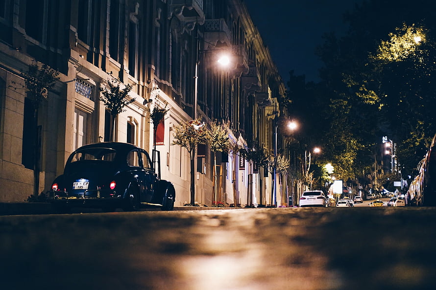 Vintage Beetle Parked on a Quiet European Street at Night HD wallpaper