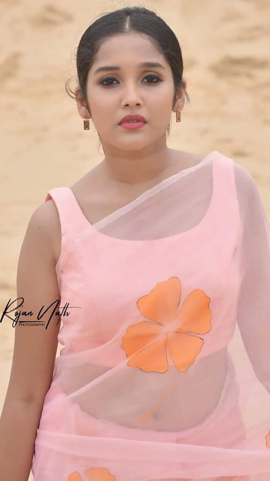 Anikha Surendran in a Pink Floral Saree with Orange Blossom Motif HD phone wallpaper