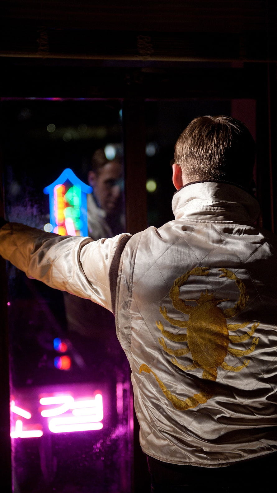 Drive Movie Scene: Man in Scorpion Jacket at Neon-Lit Window HD phone wallpaper