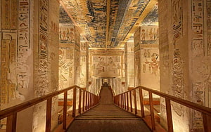 Ancient Egyptian Tomb Corridor with Hieroglyphic Walls and Wooden Staircase HD wallpaper