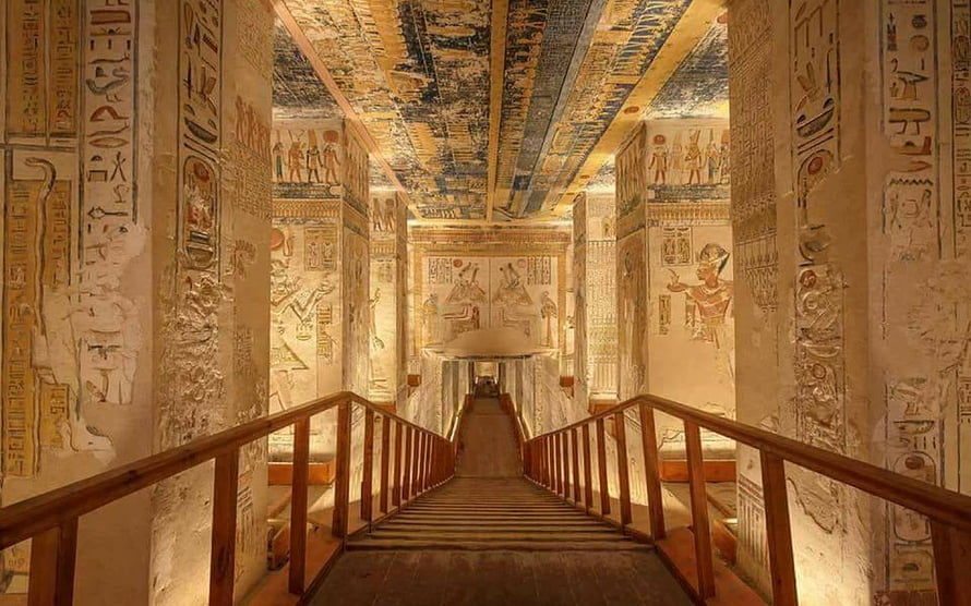Ancient Egyptian Tomb Corridor with Hieroglyphic Walls and Wooden Staircase HD wallpaper