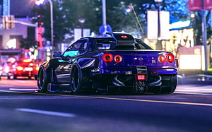 Purple Nissan Skyline GT-R R34 Widebody Stance on a Neon-Lit City Street at Night HD wallpaper
