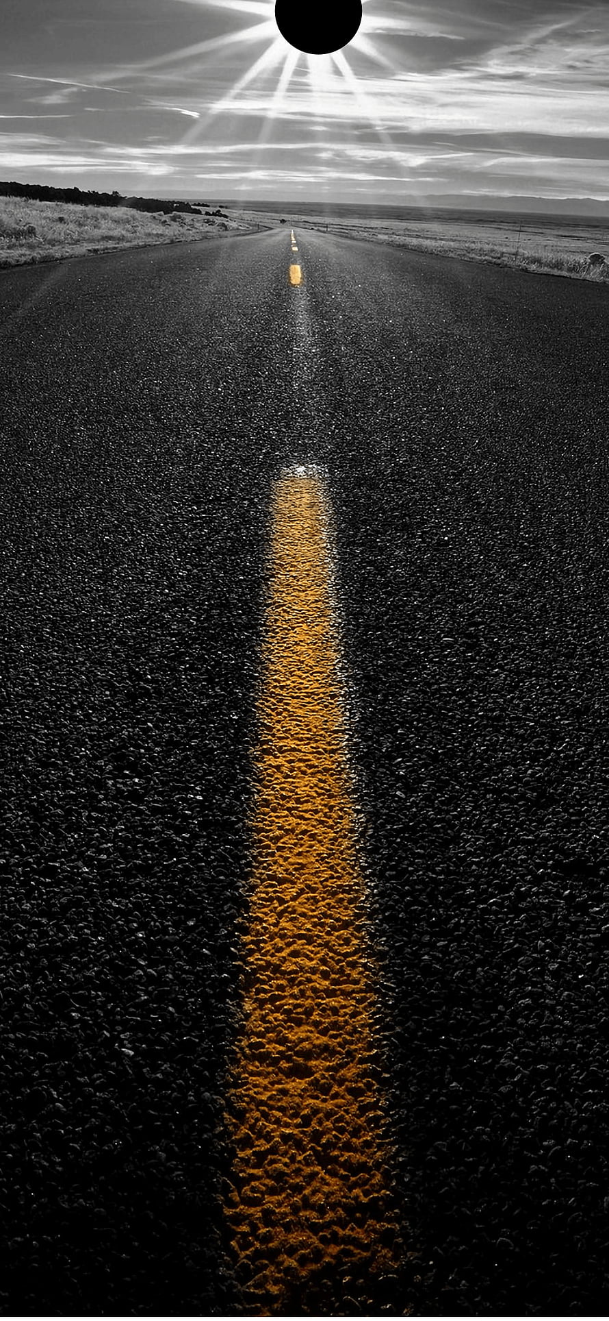 Black and White Highway with Golden Center Line and Sunburst Sky HD phone wallpaper