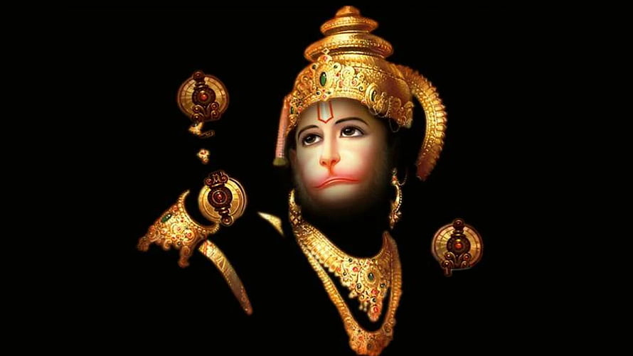 Lord Hanuman in ornate golden crown and jewelry against a dark background HD wallpaper