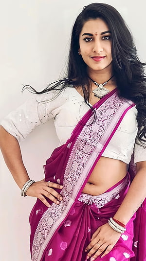 Vishnupriya in a Magenta Silk Saree with White Blouse and Traditional Jewelry HD phone wallpaper