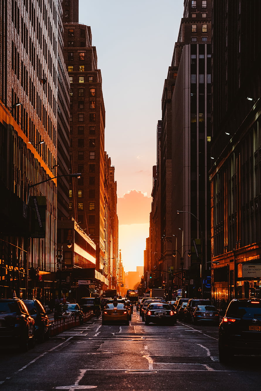 New York City Street View at Golden Hour with Traffic and Tall Buildings HD phone wallpaper
