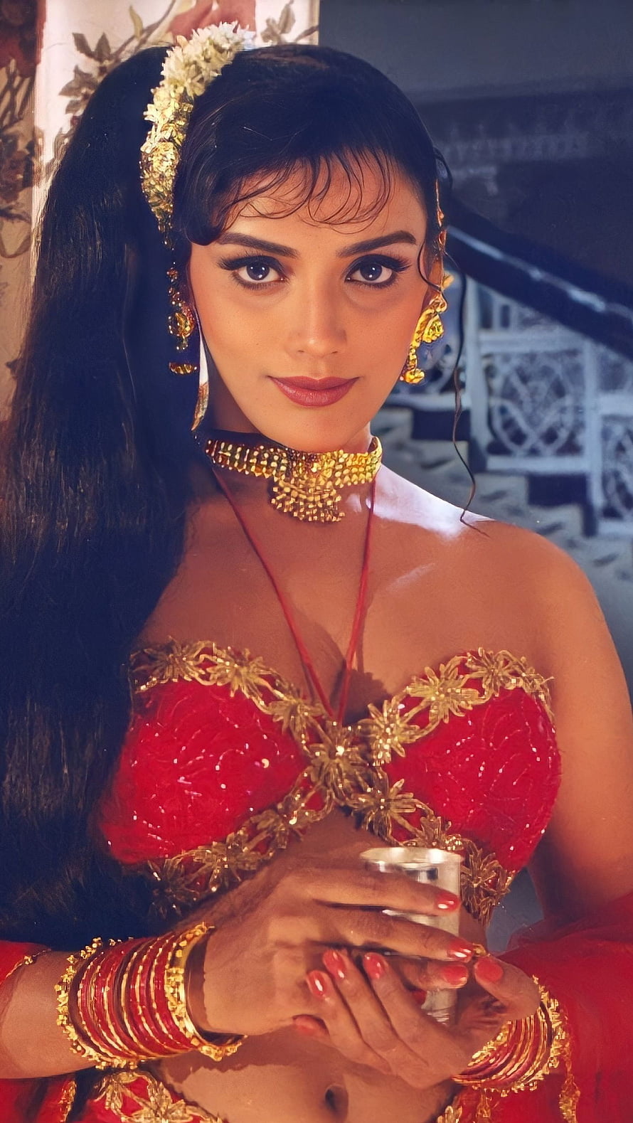 Swetha Menon in Traditional Red Attire with Gold Jewelry and Floral Hairpiece HD phone wallpaper