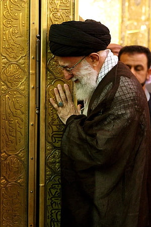 Ali Khamenei in Prayer at the Golden Shrine of Imam Reza HD phone wallpaper