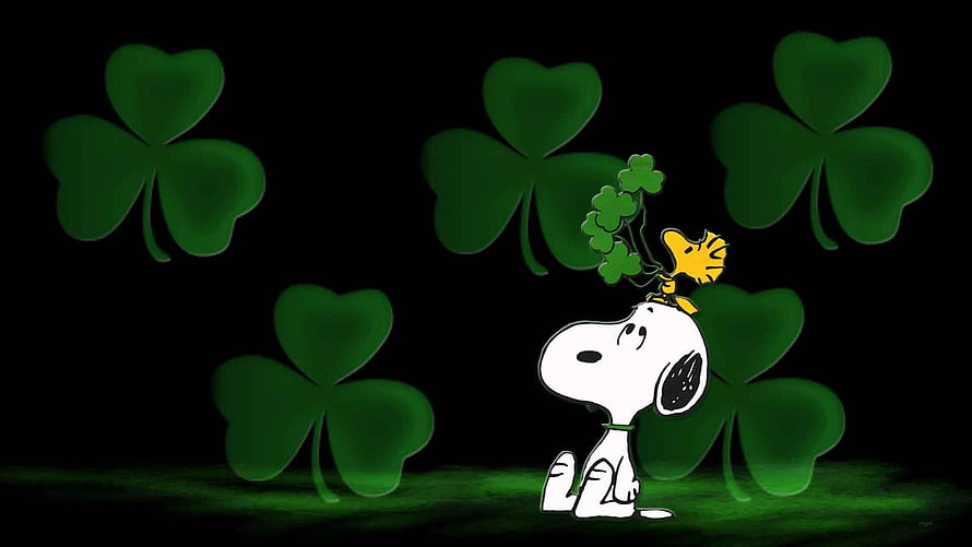 Snoopy and Woodstock with Glowing Shamrocks on a Dark St. Patrick's Day Background HD wallpaper