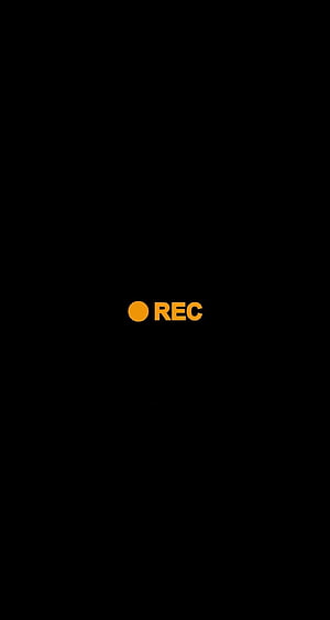 Minimalist Recording Indicator with Orange Dot and Text on Black Background HD phone wallpaper