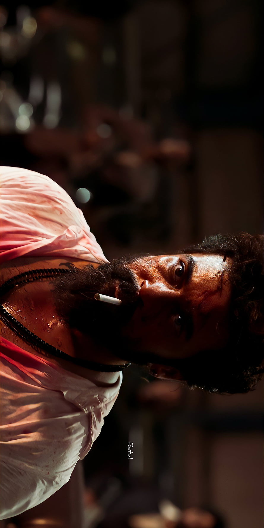 Suriya as Kaithi in a gritty close-up with cigarette and blood-stained shirt HD phone wallpaper